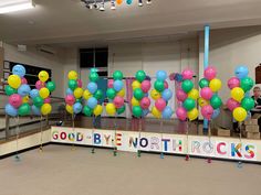 there are many balloons in the room with words on it that say good bye northrocks