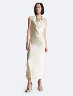 Featuring a lustrous glow, this maxi dress embodies effortless elegance. Cut in a sleeveless silhouette with a gentle drape at the halter neckline. Designed with a zip closure at the back.  Material: 73% Ethyl Vinyl Acetate, 27% Polyester. Calvin Klein, Effortless Elegance, Calvin Klein Woman, Halter Neckline, Dress Clothes For Women, Wedding Guest, Maxi Dress, Womens Dresses, Vinyl