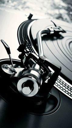 an old record player with its turntables and other accessories in black and white