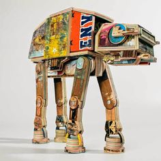 an origami replica of a star wars at - at walker made out of magazines