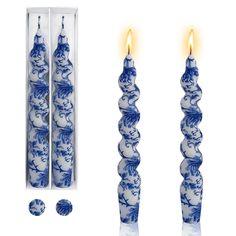 two blue and white candles are next to each other