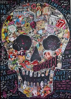 a skull covered in lots of stickers and writing on the side of a wall