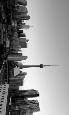 a black and white photo of the top of a building in new york city, ny