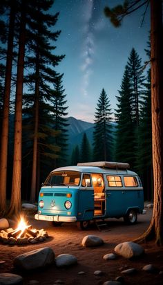 a camper van parked in the woods at night