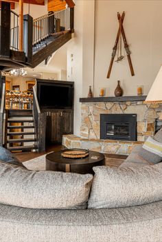 a living room filled with furniture and a fire place