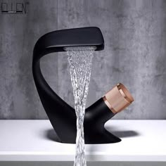 a faucet with water running out of it's sides and a black handle