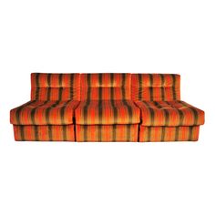 an orange and black striped couch on a white background