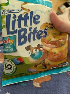 someone holding up a bag of little bites