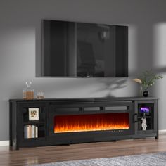 an entertainment center with a fireplace in the middle