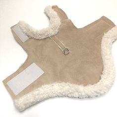 a tan sheepskin coat with white shears