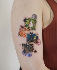 a woman's arm with an animal themed piece of art on the left shoulder