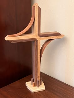 a wooden cross sitting on top of a table