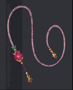 a pink necklace with flowers on it and a long cord attached to the neckline