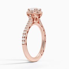 Tacori Petite Crescent Bloom Diamond Engagement Ring - 18K Rose Gold. A halo of diamonds surrounds a glistening center stone encased by double bead prongs in this eye-catching ring. Diamond-accented cathedral shoulders and petite crescents along the side of the band add a glamorous, unique flai. The style of this piece allows wedding rings to sit perfectly flush against the band (2/5 total carat weight). 
 
 Our perfect fit engagement rings are carefully designed to sit flush against a variety o Formal Halo Ring With Lab Grown Diamond, Rose Gold Halo Diamond Ring For Wedding, Anniversary Rose Gold Halo Ring, Formal Halo Design Lab Grown Diamond Ring, Exquisite Halo Ring With Center Stone, Luxury Diamond Ring With Halo Setting, Exquisite Diamond Wedding Ring With Halo Design, Elegant Diamond Halo Wedding Ring, Dazzling Rose Gold Cluster Ring For Wedding