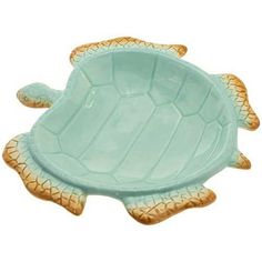 a ceramic turtle shaped dish on a white background