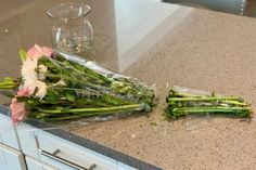 some flowers are laying on the counter top