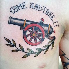 a man's chest with an old cannon tattoo on it that says, come and take it