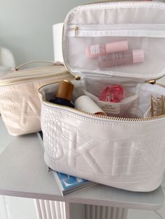 Leather open top bag with skin embossed in white This bag is GORGEOUS Perfect train case for travel and storing all makeup! 7.5” W x 5” H x 5.2” D Portable White Cosmetic Bag For Travel, White Rectangular Case For Everyday Use, White Travel Cosmetic Bag With Removable Pouch, White Rectangular Cosmetic Bag For Storage, Elegant White Cosmetic Bag For Travel, Elegant White Travel Cosmetic Bag, White Portable Cosmetic And Toiletry Storage For Daily Use, Portable White Cosmetic And Toiletry Storage For Daily Use, White Rectangular Cosmetic Bag With Zipper