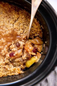 a crock pot filled with oatmeal and fruit