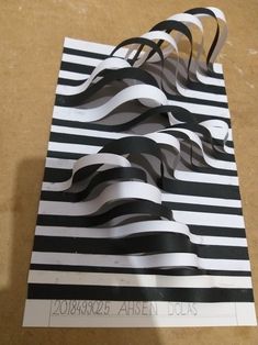 a black and white striped bag sitting on top of a table