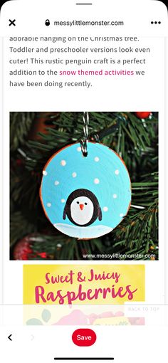 a penguin ornament hanging from a christmas tree