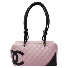 Major Y2K vibes! From 2003, in a gorgeous pink quilted leather with a large black CC logo, with silver-tone hardware and dual rolled black handles. There is a pocket on the outside and protective feet at the base. The zipper pull is a gorgeous Chanel chain that opens up to a black Jacquard Chanel logo lining with two interior pockets. The silhouette is gorgeous; the shoulder strap drops are ideal, and there is ample room for your necessities. SPECIFICS Height: 6.5" Width: 11" Depth: 4" Shoulder Channel Pink Bag, Pink Quilted Leather Bag, Chanel 2000s, Pink Items, 2000s Pink, Chanel Chain, Mode Chanel, Quilted Shoulder Bag, Black Handles