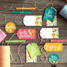 some tags and twine on a wooden table