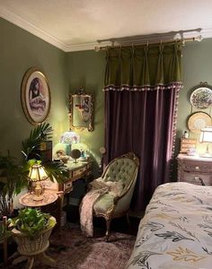 a bedroom with green walls and furniture in it