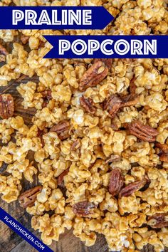 a close up of popcorn with pecans on top and the words praline popcorn above it