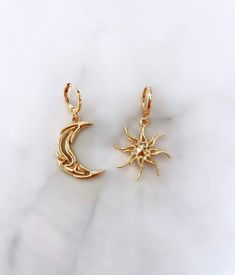 Sun and moon inspired hoop dangle earrings Colour: gold Theme: sun and moon Type: hoop dangle Sun Aesthetic Jewelry, Sun And Moon Pendant, Moon And Sun Earrings, Sun And Moon Earring, Sun Moon And Stars Earrings, Sun Moon Earrings, Sun And Moon Jewelry, Sun And Moon Earrings, Sun Nose Ring