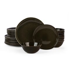 a stack of black dishes with one bowl on the side and six plates in front