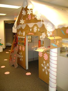 an office decorated for christmas with gingerbread houses