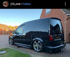 a black van parked in front of a house