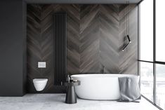 a white bath tub sitting next to a toilet in a room with wooden walls and flooring