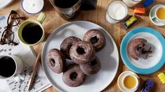 donuts and cups of coffee on a table