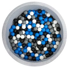 a bowl filled with blue, white and black balls