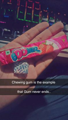 someone holding a candy bar in their hand with the caption, chewing gum is the example that gum never ends