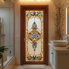 a bathroom with a large stained glass door