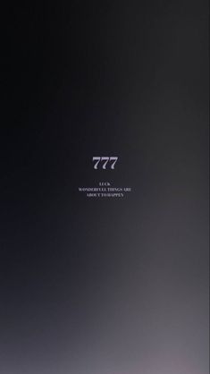 an abstract black and white photo with the word 777 written in silver on it