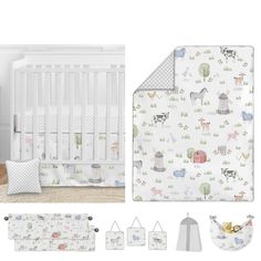 a baby crib bedding set with animals and trees