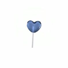 a blue heart shaped lollipop on a stick