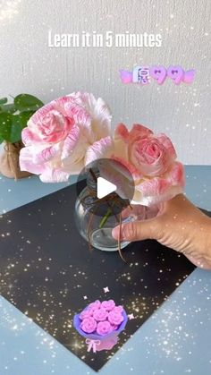 a person holding flowers in a vase on top of a table with the words learn it in 5 minutes