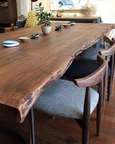 a large wooden table with chairs around it