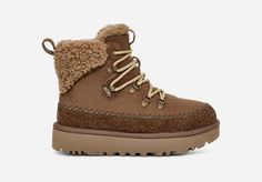 A fusion of mountain town style and premium UGG® comfort sets the Classic Alpine Lace-Up apart. It's crafted with iconic textures like the curly sheepskin collar, upcycled UGG®plush lining, and smooth suede upper. Round laces and Heritage Twin Seam details give this boot depth, while the sugarcane EVA outsole features deeper lugs that give better traction for those first-snowfall walks. | Suede upper. Metal eyelets, Rear pull tab, Speed hooks, 10mm curly sheepskin collar, UGG®braid detailing, Le Ugg Winter Hiker Boot, Ugg Lace Up Boots, Lace Ugg Boots, Ugg Ancle Winter Boots, Winter Lace-up Shearling Boots With Round Toe, Uggs Outfit, Ugg Classic, Classic Boots, Real Fur