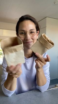 a woman is holding some kind of object in her hands