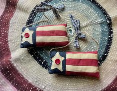 two red, white and blue stars are sitting on a rug