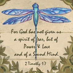 a blue dragonfly sitting on top of a piece of paper with words written below it