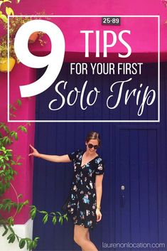 a woman standing in front of a pink building with the words 9 tips for your first solo trip