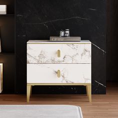 a black and white marbled chest of drawers in a room with wood flooring