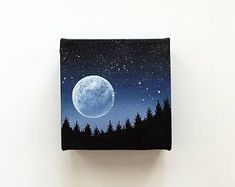 a night sky with the moon and trees painted on it